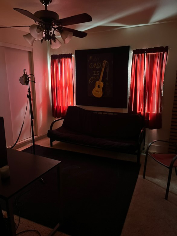 The West Room — lounge with red curtains